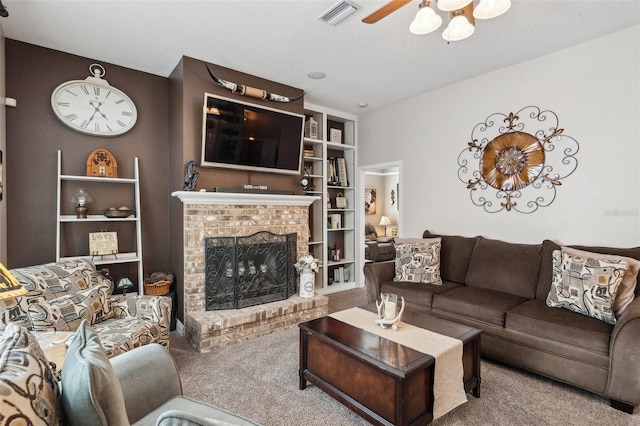 6824 283rd St E, Myakka City, FL 34251 - living room featuring carpet, ceiling fan, a fireplace, and built in features