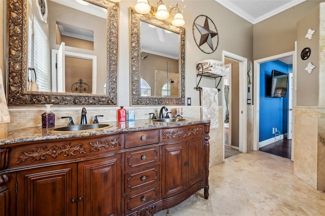 6824 283rd St E, Myakka City, FL 34251 - full bathroom featuring ornamental molding, tile walls, double vanity, and a wainscoted wall