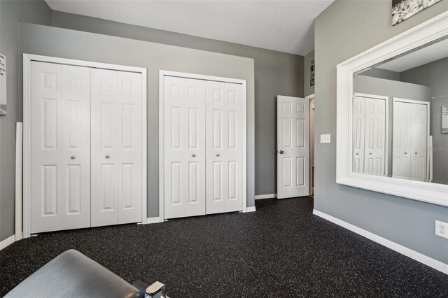 6824 283rd St E, Myakka City, FL 34251 - unfurnished bedroom featuring multiple closets and baseboards