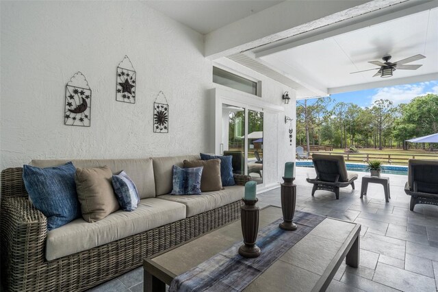 6824 283rd St E, Myakka City, FL 34251 - view of patio / terrace with a ceiling fan, an outdoor living space, an outdoor pool, and fence
