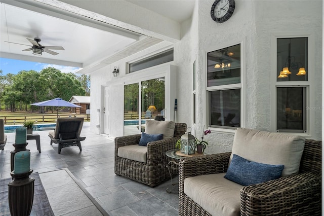 6824 283rd St E, Myakka City, FL 34251 - view of patio with ceiling fan and an outdoor pool