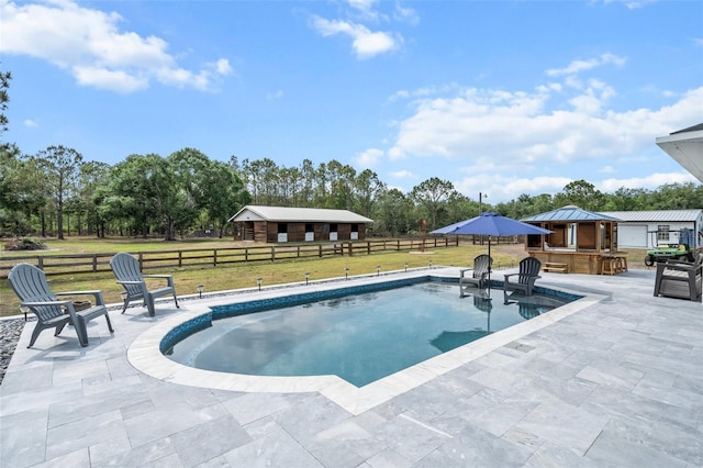 6824 283rd St E, Myakka City, FL 34251 - swimming pool featuring a patio area and view of wooded area