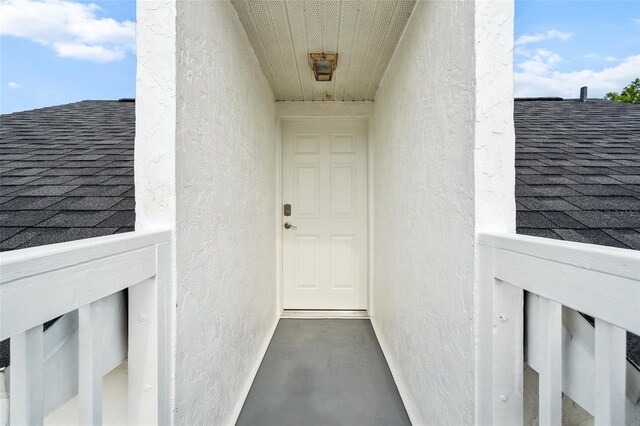 6824 283rd St E, Myakka City, FL 34251 - view of exterior entry featuring roof with shingles