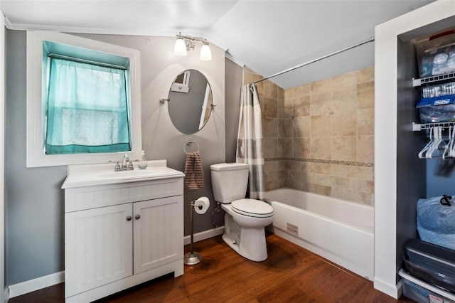 6824 283rd St E, Myakka City, FL 34251 - bathroom featuring toilet, wood finished floors, shower / tub combo with curtain, vanity, and baseboards