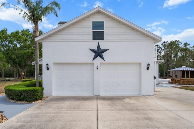 6824 283rd St E, Myakka City, FL 34251 - view of property exterior with stucco siding and a detached garage