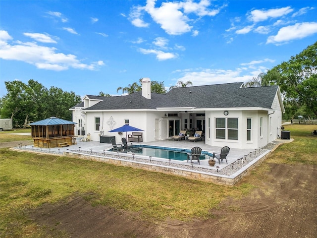 6824 283rd St E, Myakka City, FL 34251 - rear view of house featuring a patio, a gazebo, a yard, and outdoor lounge area