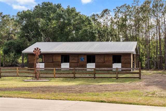 6824 283rd St E, Myakka City, FL 34251 - view of front of home featuring an exterior structure, metal roof, and an outbuilding