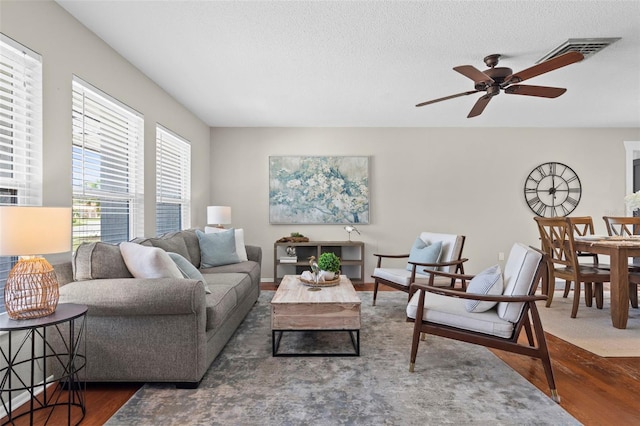 205 Cavallini Dr, Nokomis, FL 34275 - living room featuring wood finished floors, a textured ceiling, and ceiling fan