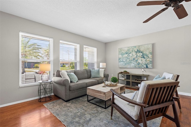 205 Cavallini Dr, Nokomis, FL 34275 - living area featuring wood finished floors, baseboards, and a healthy amount of sunlight