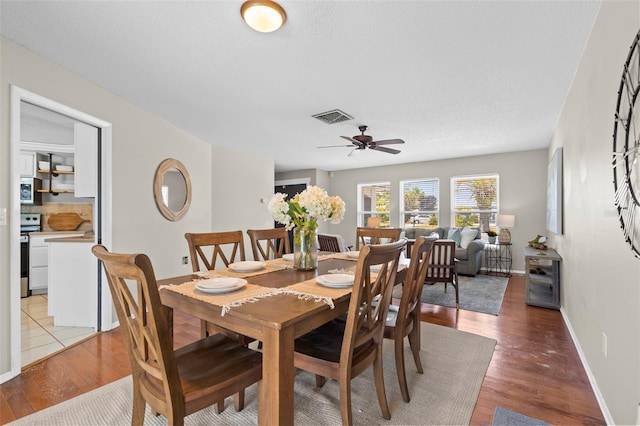 205 Cavallini Dr, Nokomis, FL 34275 - dining space with light wood-style flooring, visible vents, a ceiling fan, and baseboards