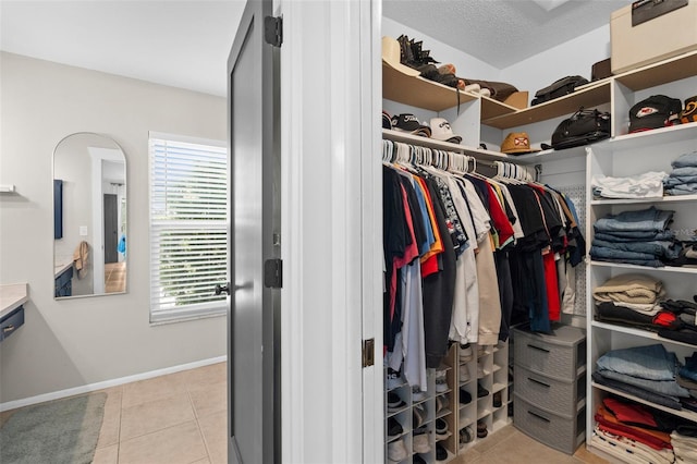 205 Cavallini Dr, Nokomis, FL 34275 - spacious closet featuring light tile patterned floors