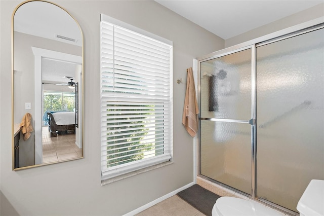 205 Cavallini Dr, Nokomis, FL 34275 - bathroom featuring tile patterned flooring, toilet, a shower with shower door, and visible vents