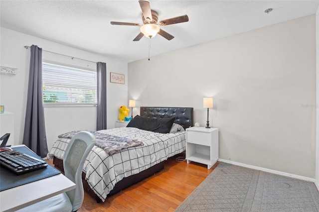 205 Cavallini Dr, Nokomis, FL 34275 - bedroom with baseboards, a ceiling fan, and wood finished floors
