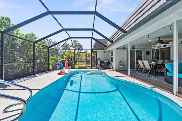 205 Cavallini Dr, Nokomis, FL 34275 - outdoor pool featuring a lanai, outdoor dining space, a patio, and a ceiling fan