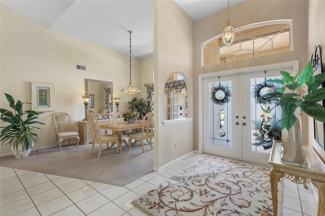511 Governors Green Dr, Venice, FL 34293 - entrance foyer featuring a high ceiling, visible vents, light tile patterned floors, french doors, and baseboards