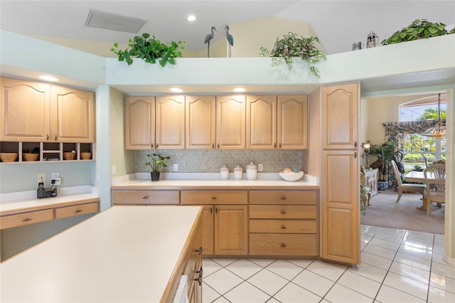 511 Governors Green Dr, Venice, FL 34293 - kitchen featuring light brown cabinetry, visible vents, decorative backsplash, light countertops, and high vaulted ceiling