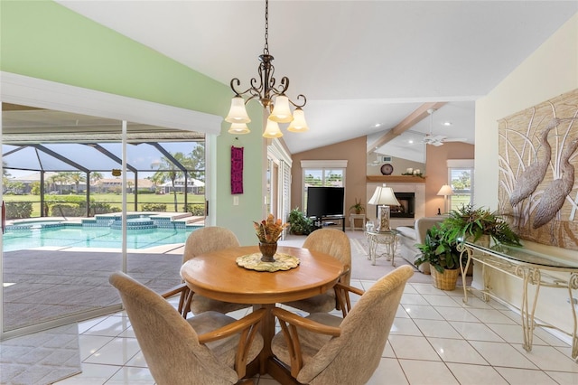 511 Governors Green Dr, Venice, FL 34293 - dining area with vaulted ceiling with beams, light tile patterned flooring, a fireplace, a sunroom, and ceiling fan with notable chandelier
