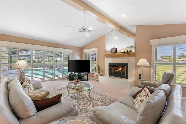 511 Governors Green Dr, Venice, FL 34293 - carpeted living area featuring lofted ceiling with beams, a ceiling fan, and a premium fireplace
