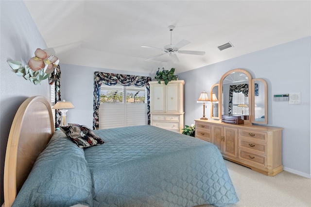 511 Governors Green Dr, Venice, FL 34293 - bedroom with baseboards, visible vents, light colored carpet, lofted ceiling, and a ceiling fan