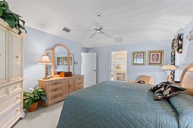 511 Governors Green Dr, Venice, FL 34293 - bedroom with ceiling fan, ensuite bath, visible vents, and light colored carpet