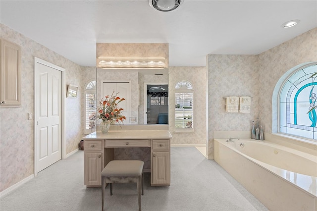 511 Governors Green Dr, Venice, FL 34293 - bathroom with baseboards, a garden tub, wallpapered walls, and plenty of natural light