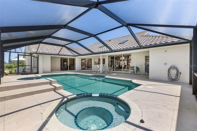 511 Governors Green Dr, Venice, FL 34293 - view of swimming pool featuring glass enclosure, a patio, and a pool with connected hot tub