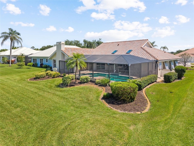 511 Governors Green Dr, Venice, FL 34293 - rear view of property featuring a tile roof, glass enclosure, an outdoor pool, a yard, and stucco siding
