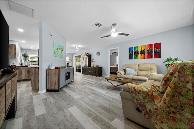 3355 Roslyn Rd, Venice, FL 34293 - living area featuring visible vents, baseboards, attic access, light wood-style flooring, and ceiling fan