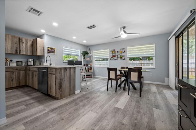 3355 Roslyn Rd, Venice, FL 34293 - kitchen featuring a peninsula, stainless steel dishwasher, visible vents, and light countertops
