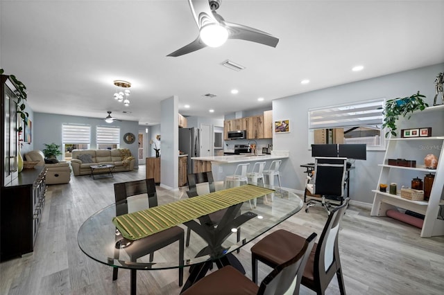 3355 Roslyn Rd, Venice, FL 34293 - dining room featuring light wood-type flooring, visible vents, and ceiling fan