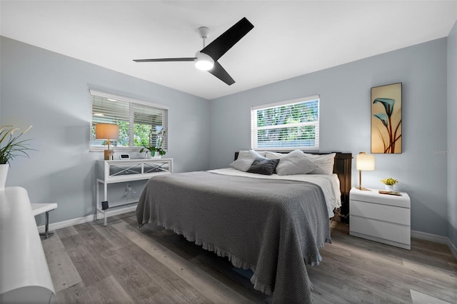 3355 Roslyn Rd, Venice, FL 34293 - bedroom with wood finished floors, baseboards, and ceiling fan