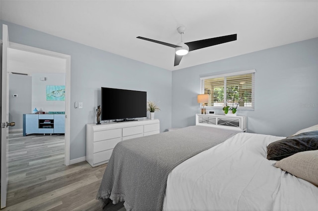 3355 Roslyn Rd, Venice, FL 34293 - bedroom featuring baseboards, a ceiling fan, and light wood-style floors
