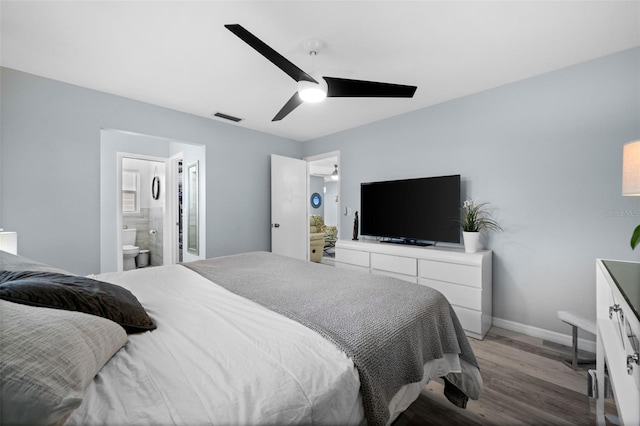 3355 Roslyn Rd, Venice, FL 34293 - bedroom featuring wood finished floors, visible vents, a ceiling fan, ensuite bath, and baseboards