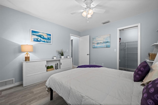 3355 Roslyn Rd, Venice, FL 34293 - bedroom featuring baseboards, wood finished floors, visible vents, and ceiling fan