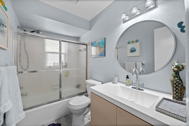 3355 Roslyn Rd, Venice, FL 34293 - full bathroom with wood finished floors, vanity, toilet, and enclosed tub / shower combo
