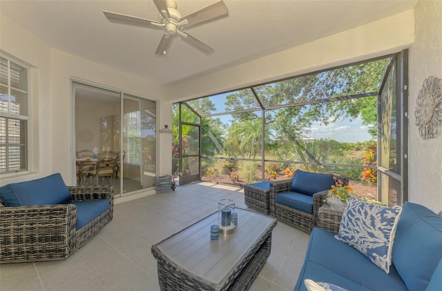 sunroom / solarium featuring a ceiling fan and an outdoor hangout area