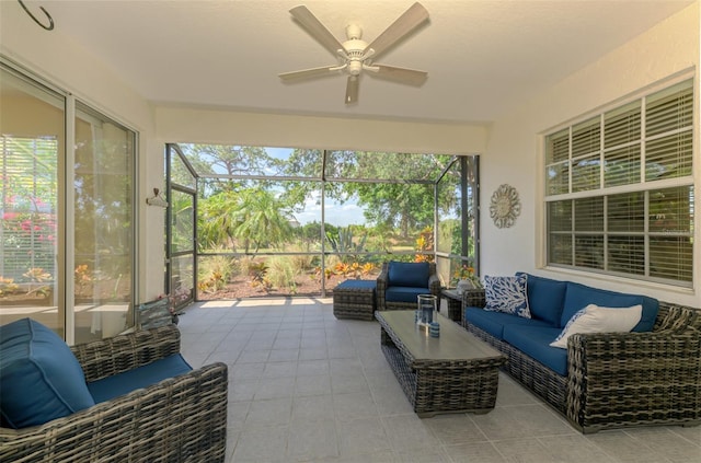 sunroom / solarium featuring a ceiling fan and outdoor lounge area
