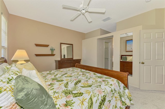 bedroom with visible vents, a ceiling fan, and carpet floors