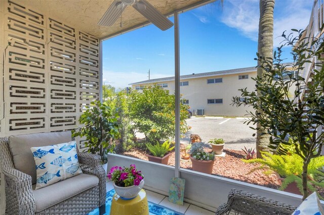360 Base Ave E Unit 413, Venice, FL 34285 - balcony with an outdoor hangout area and a ceiling fan