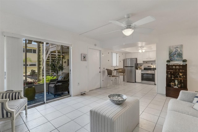 360 Base Ave E Unit 413, Venice, FL 34285 - living room with light tile patterned flooring and a ceiling fan