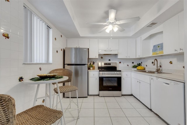 360 Base Ave E Unit 413, Venice, FL 34285 - kitchen featuring stainless steel appliances, a sink, visible vents, light countertops, and under cabinet range hood