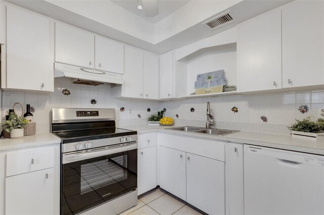 360 Base Ave E Unit 413, Venice, FL 34285 - kitchen featuring white dishwasher, a sink, stainless steel range with electric cooktop, under cabinet range hood, and visible vents