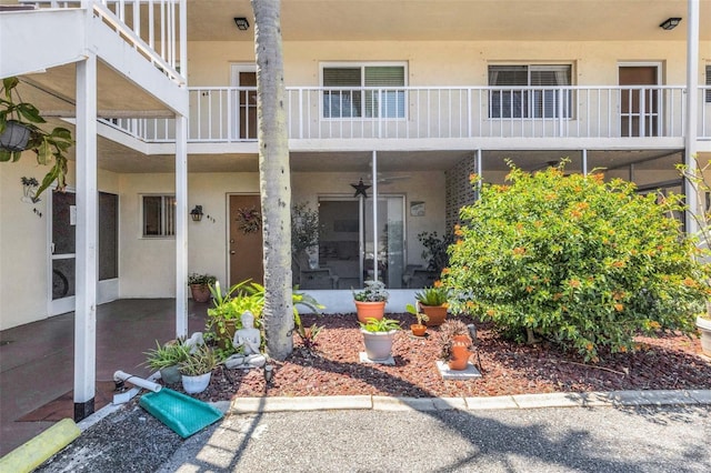 360 Base Ave E Unit 413, Venice, FL 34285 - doorway to property with a balcony and stucco siding
