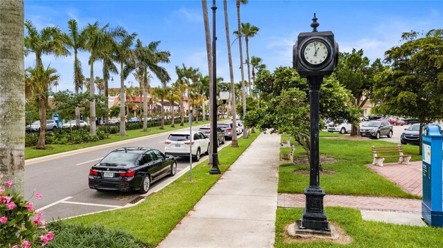 360 Base Ave E Unit 413, Venice, FL 34285 - view of property's community featuring uncovered parking and a yard