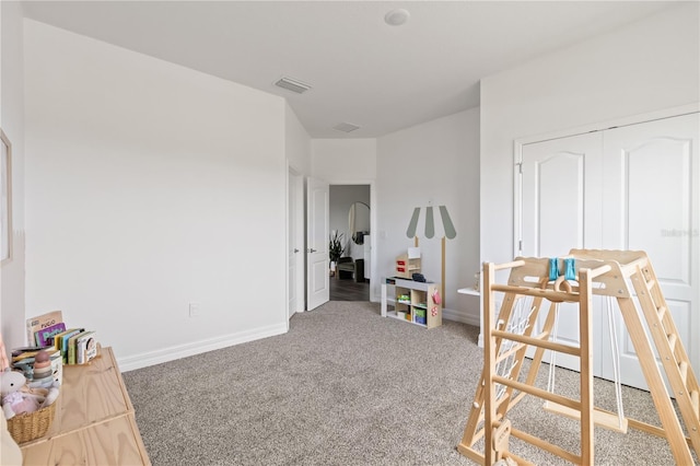 12199 Xavier Ave, Port Charlotte, FL 33981 - recreation room featuring carpet floors, visible vents, and baseboards