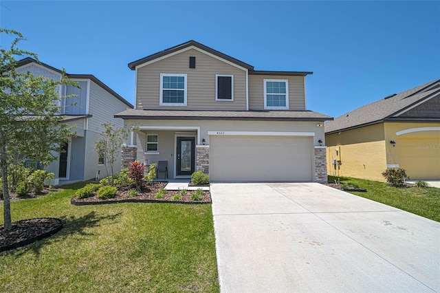 4523 Birdsong Dr, Palmetto, FL 34221 - view of front of house featuring stone siding, an attached garage, driveway, and a front lawn