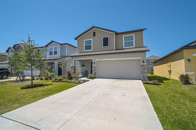 4523 Birdsong Dr, Palmetto, FL 34221 - view of front of home with a garage, driveway, stone siding, and a front lawn