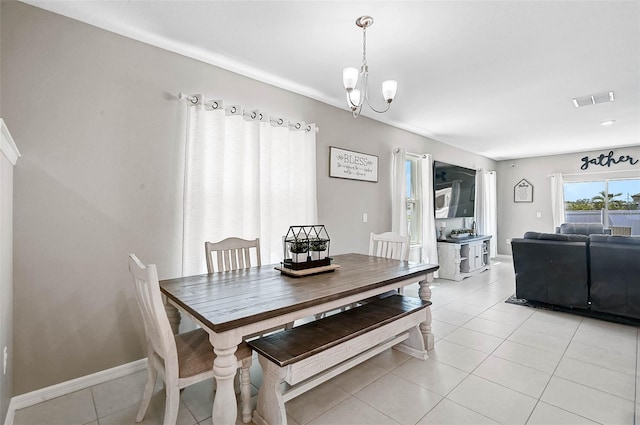 4523 Birdsong Dr, Palmetto, FL 34221 - dining room with baseboards, an inviting chandelier, visible vents, and light tile patterned floors