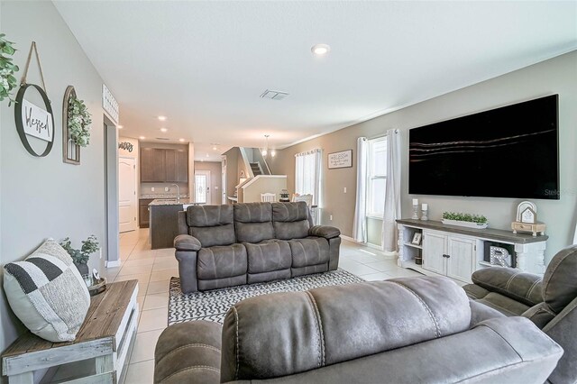 4523 Birdsong Dr, Palmetto, FL 34221 - living area with light tile patterned flooring, visible vents, baseboards, and recessed lighting