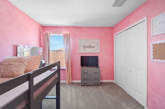 4523 Birdsong Dr, Palmetto, FL 34221 - carpeted bedroom with baseboards, visible vents, and a closet